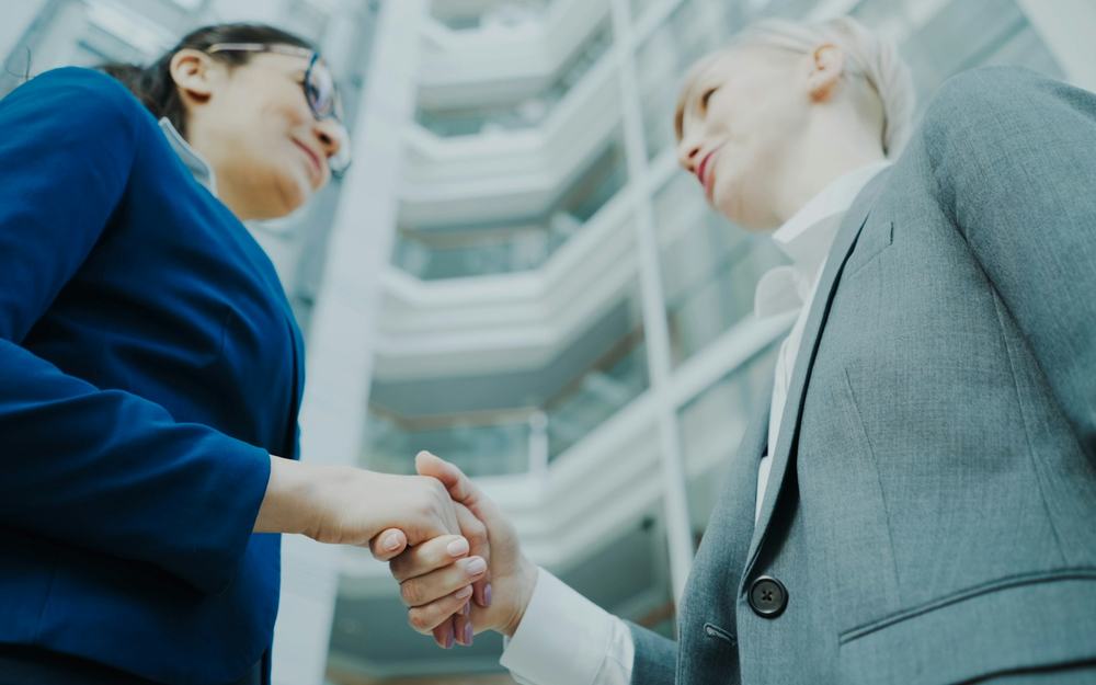 Professionals in corporate uniform in a modern office