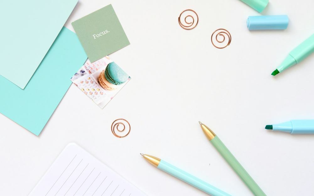 Office stationery and paper supplies on a desk