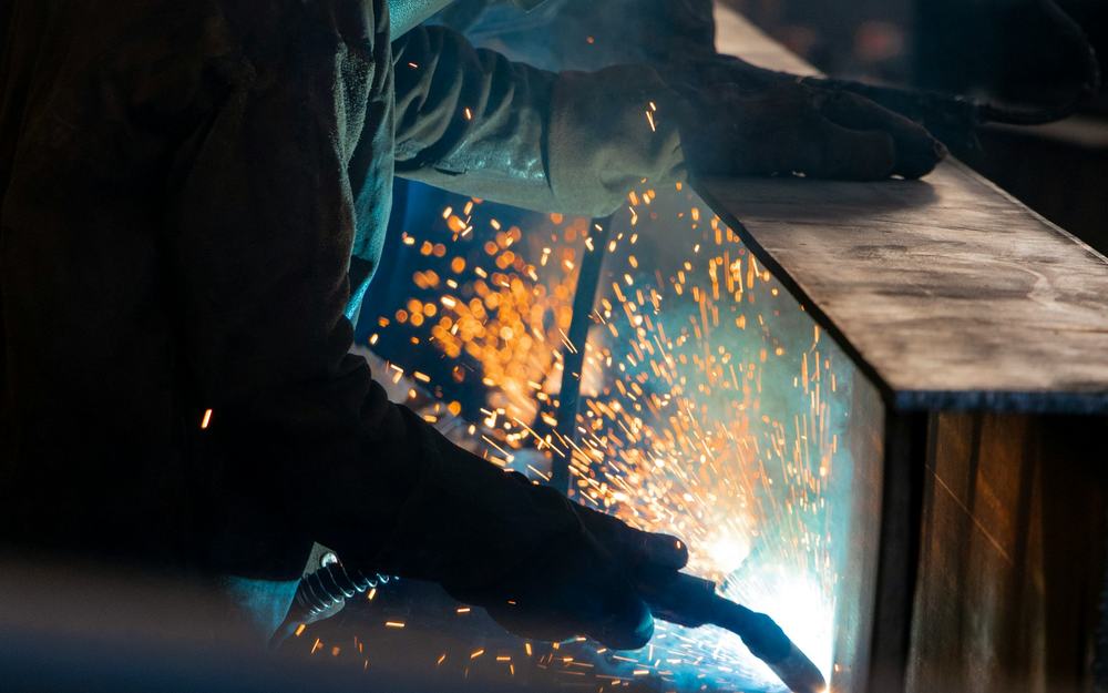 Industrial process environment where chemical-resistant protective equipment is used